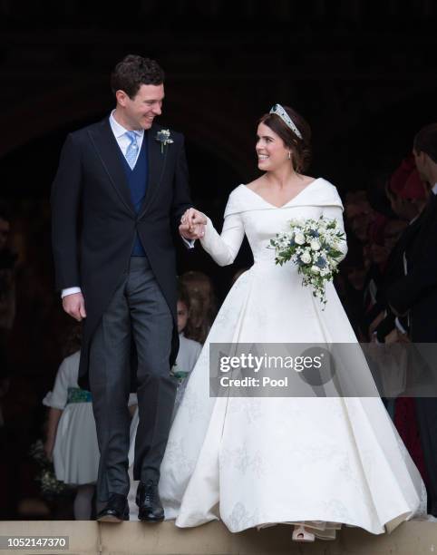 Princess Eugenie of York and Jack Brooksbank leave St George's Chapel in Windsor Castle following their wedding at St. George's Chapel on October 12,...