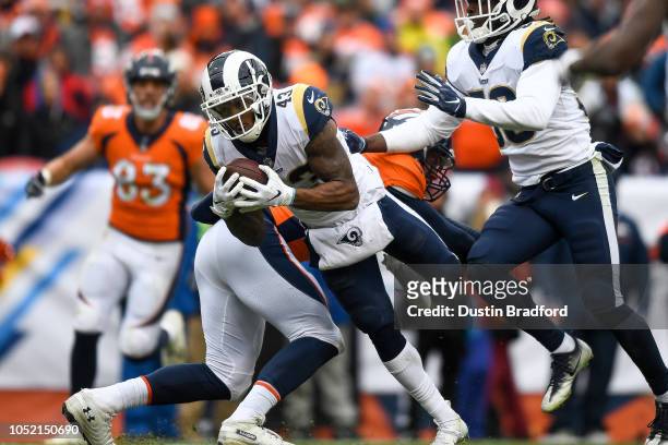 Strong safety John Johnson of the Los Angeles Rams intercepts a pass intended for tight end Brian Parker of the Denver Broncos in the third quarter...