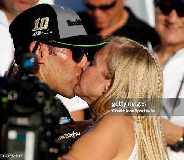 Aric Almirola, Stewart-Haas Racing, Ford Fusion Smithfield Bacon for Life with wife Janice during the runinng of the 1000Bulbs.com500 on Sunday...