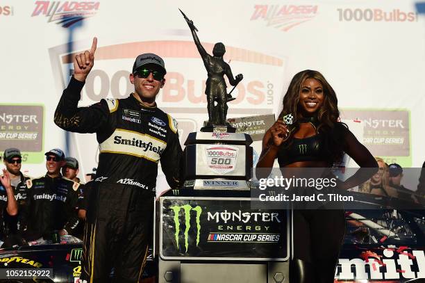 Aric Almirola, driver of the Smithfield Bacon for Life Ford, celebrates in victory lane after winning the Monster Energy NASCAR Cup Series...