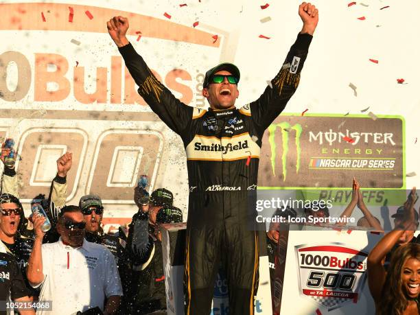 Aric Almirola, Stewart-Haas Racing, Ford Fusion Smithfield Bacon For Life celebrates in Victory Lane after winning during the 1000Bulbs.com 500 on...