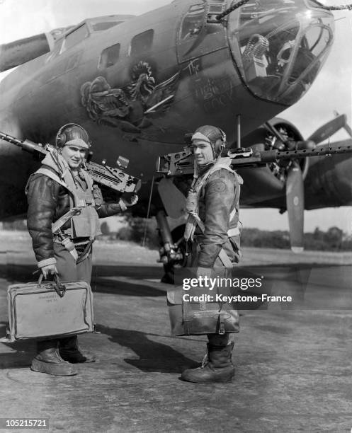 Two Young American Gunners Prepare To Load A B-17 Flying Fortress For Bombing The Germans In 1944.