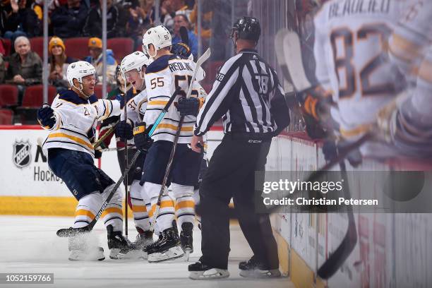 Kyle Okposo, Casey Mittelstadt, Jeff Skinner and Rasmus Ristolainen of the Buffalo Sabres celebrate after Skinner scored a goal against the Arizona...