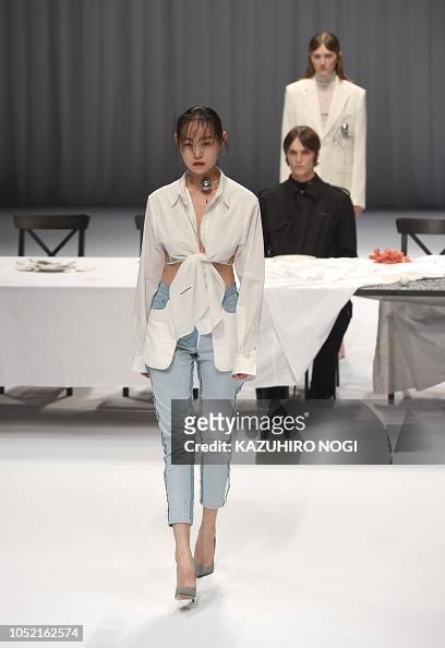 A model presents a creation from the fashion brand DRESSEDUNDRESSED ...