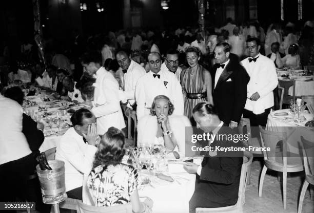 In 1938, Actress Marlene Dietrich Dines With Her Husband Rudolf Sieber And The German Writer Erich Maria Remarque- In A Restaurant In The Cote D'Azur.