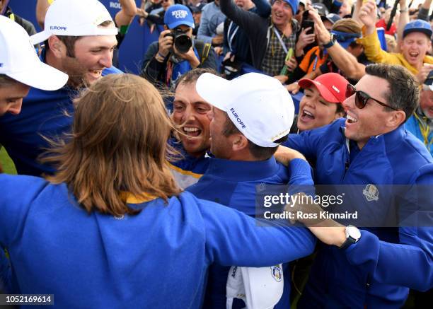 Francesco Molinari of Europe is congratulated after getting the point that confitmed the winning of The Ryder Cup during singles matches of the 2018...