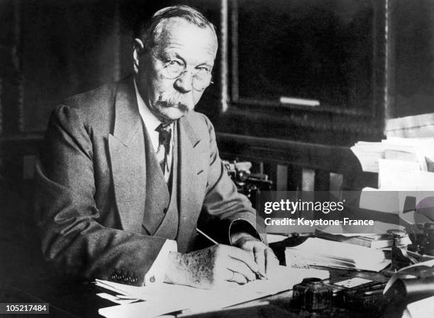 The English Writer Sir Arthur Conan Doyle Writing At His Desk In 1923.