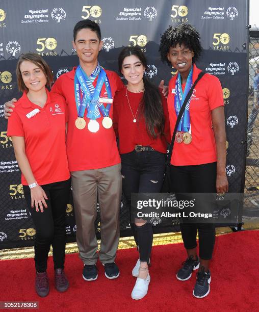 Special Olympics athletes Brett Laza, Kyla Schilz and Krystal Johnson pose with Gianna Adams at the Special Olympics Pier Del Sol held at Pacific...