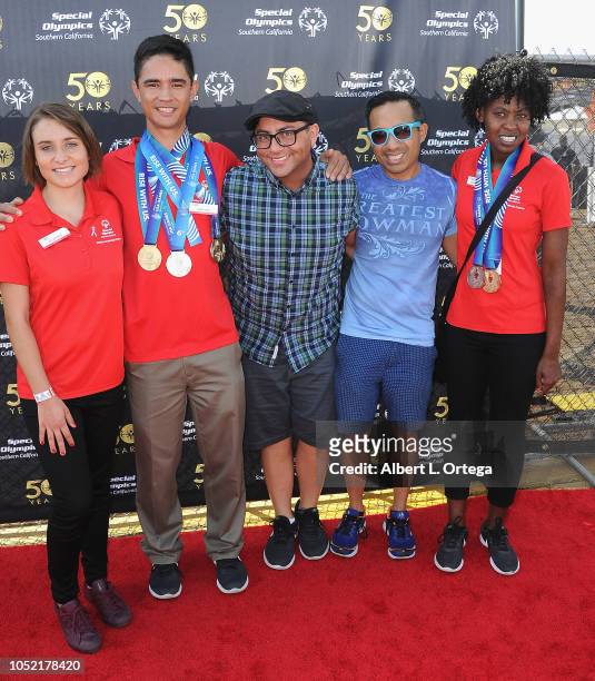 Special Olympics athletes Brett Laza, Kyla Schilz and Krystal Johnson pose with Pauly & Morks of "Gay Uncles" at the Special Olympics Pier Del Sol...