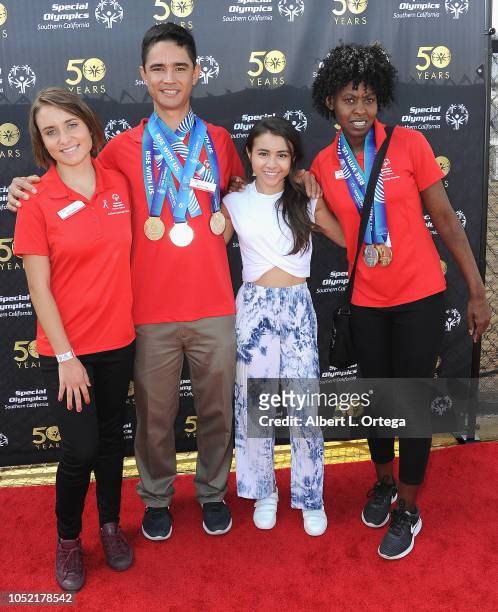 Special Olympics athletes Brett Laza, Kyla Schilz and Krystal Johnson pose withCiara A. Wilson at the Special Olympics Pier Del Sol held at Pacific...