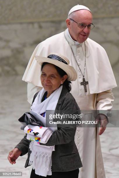 Pope Francis looks on after embracing Angela Morales, the personal assistant of slain Salvadoran archbishop Oscar Romero, during an audience with...