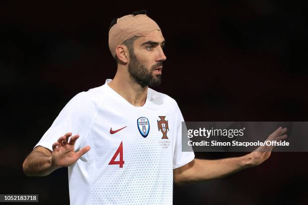 Luis Neto of Portugal gestures with a bandage around his head during the International Friendly match between Scotland and Portugal at Hampden Park...