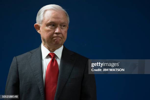 Attorney General Jeff Sessions waits to make an announcement on efforts to reduce transitional crime during a press conference at the US Attorney's...