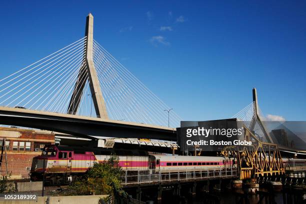 An MBTA Commuter Rail train passes over a drawbridge in Cambridge, MA on Oct. 12, 2018. Last week, the Massachusetts Bay Transportation Authority...