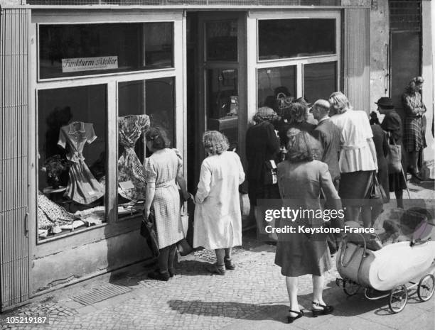 Women Contemplating Dresses, Which Had Just Arrived In West Berlin'S British Sector By Aerial American Bridges, Through The Display Window Of A...