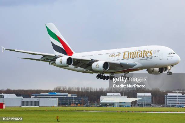 An Emirates airplane, the double-decker Airbus A380 with registration A6-EOO is approaching Amsterdam Schiphol International Airport arriving at...