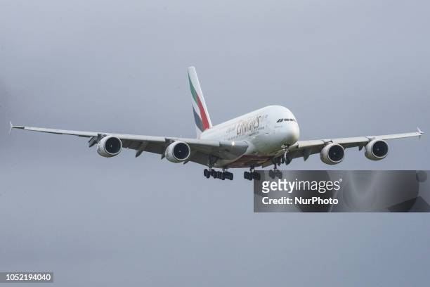 An Emirates airplane, the double-decker Airbus A380 with registration A6-EOO is approaching Amsterdam Schiphol International Airport arriving at...