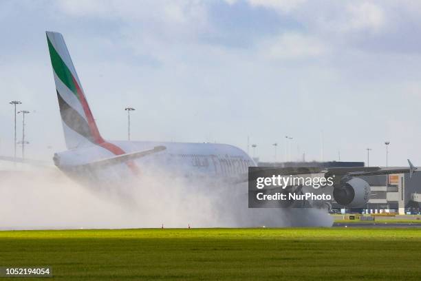 An Emirates airplane, the double-decker Airbus A380 with registration A6-EOO is approaching Amsterdam Schiphol International Airport arriving at...