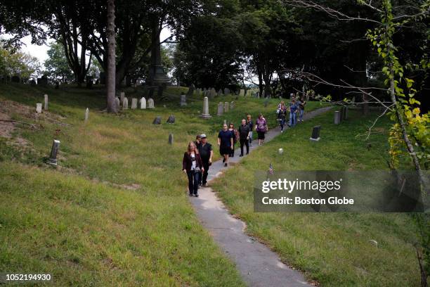 Vicki Noel Harrington, of Plymouth, and Geoffrey Campbell lead a tour through Burial Hill Cemetery in Plymouth, MA on Sep. 22, 2018. Self-described...