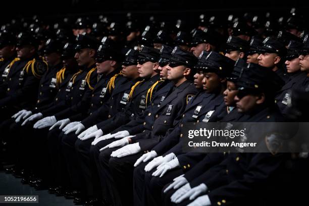 The newest members of the New York City Police Department attend their police academy graduation ceremony at the Theater at Madison Square Garden,...