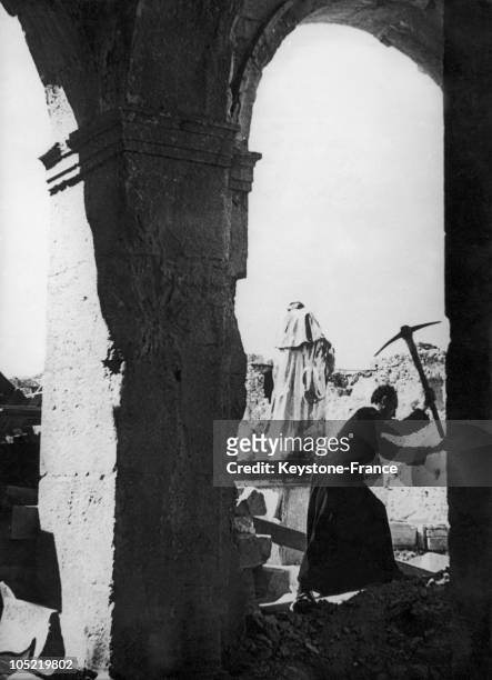 On August 16 A Monk From The Abbey Of Monte Cassino Digs Into The Ruins Of The Edifice, Destroyed In 1944 By An Allied Bombing, To Clear Away The...