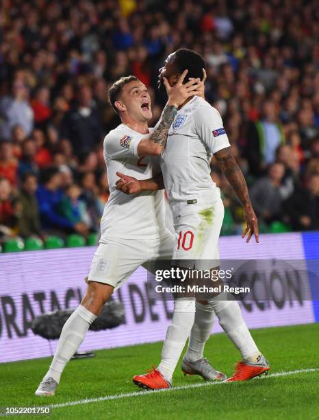 Raheem Sterling of England celebrates as he scores his team's first goal with Kieran Trippier of England during the UEFA Nations League A Group Four...