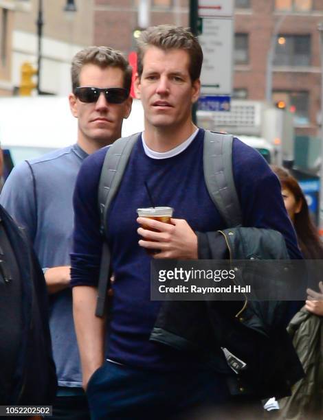 Cameron Winklevoss and Tyler Winklevoss are seen walking in soho on October 15, 2018 in New York City.