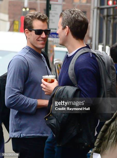 Cameron Winklevoss and Tyler Winklevoss are seen walking in soho on October 15, 2018 in New York City.