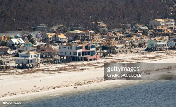 Damaged buildings are seen from a helicopter as US President Donald Trump and First Lady Melania Trump were touring damage from Hurricane Michael on...