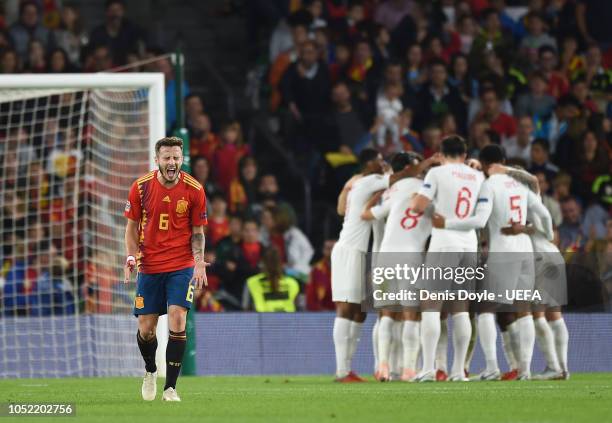 Saul Niguez of Spain reacts after England scored their 3rd goal during the UEFA Nations League A group four match between Spain and England at...