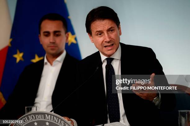 Italy's Prime Minister Giuseppe Conte speaks as Italy's Deputy Prime Minister and Minister of Economic Development, Labour and Social Policies, Luigi...