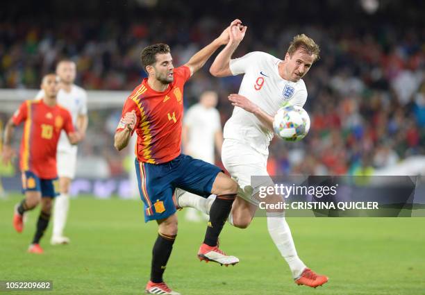 England's forward Harry Kane vies for the ball with Spain's defender Nacho during the UEFA Nations League football match between Spain and England on...