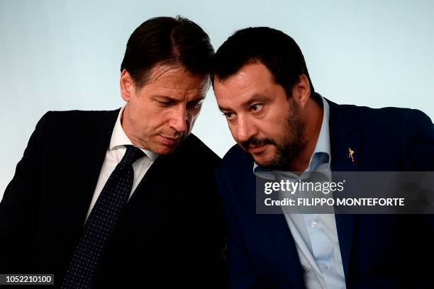 Italy's Deputy Prime Minister and Interior Minister, Matteo Salvini listens to Italy's Prime Minister, Giuseppe Conte during press conference...