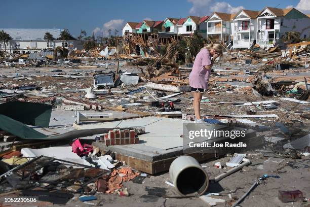 Woman is overcome with emotion as she visits the remains of her home to see if she can salvage anything after it was destroyed by Hurricane Michael...