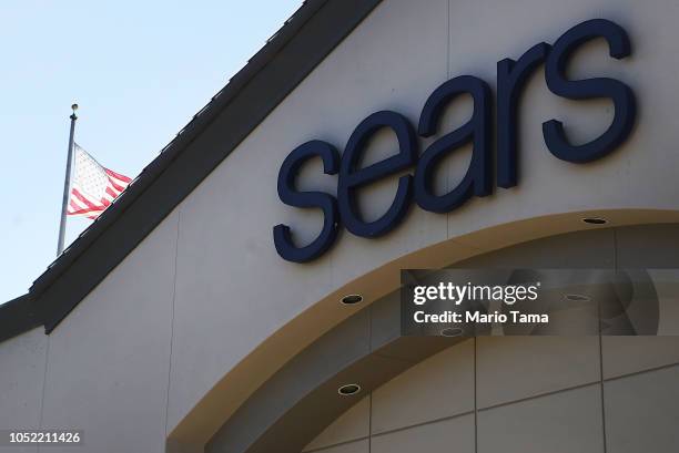 An American flag flies behind a Sears store on October 15, 2018 in Montebello, California. The iconic American retailer has filed for Chapter 11...