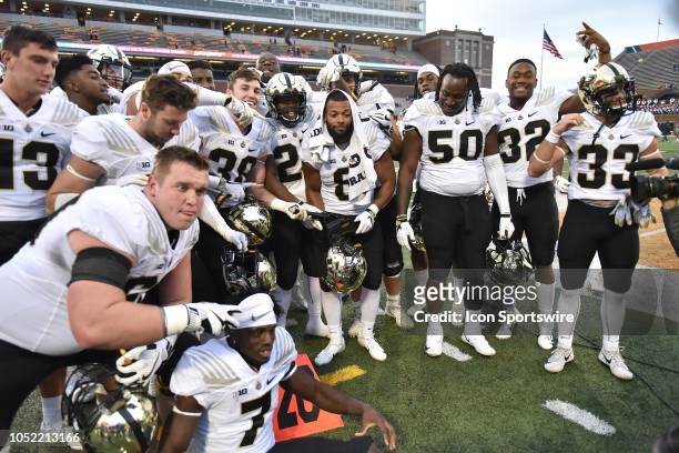 Members of the Purdue Boilermakers football team pose with the cannon trophy after winning a Big Ten Conference college football game between the...