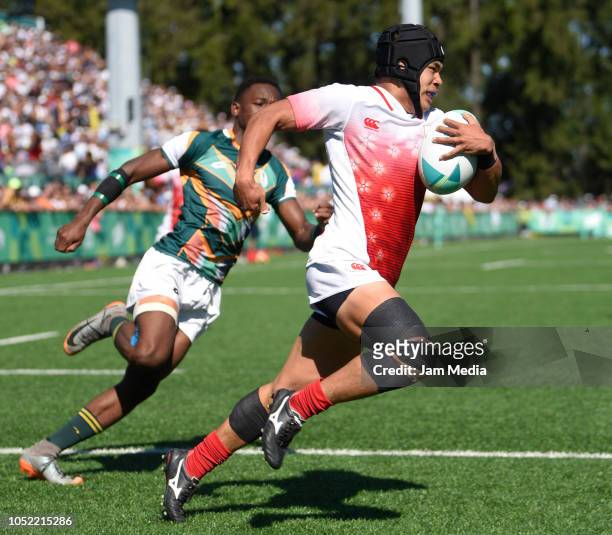 Taisei Konishi of Japan evades the tackle by Ofentse Mpho Maubane of South Africa during a match between Japan and South Africa on day 9 of Buenos...
