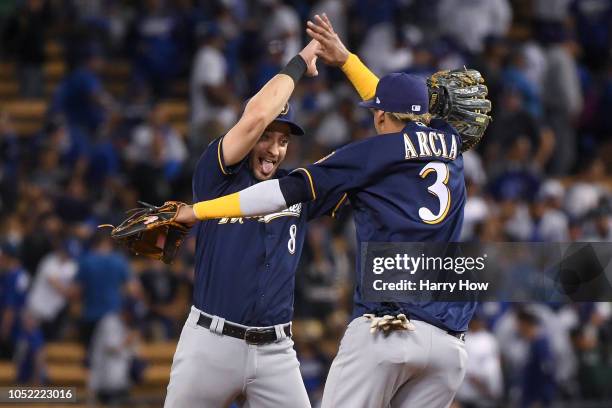 Ryan Braun and Orlando Arcia of the Milwaukee Brewers celebrate after they defeated the Los Angeles Dodgers 4-0 in Game Three of the National League...