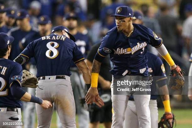 Ryan Braun and Orlando Arcia of the Milwaukee Brewers celebrate after they defeated the Los Angeles Dodgers 4-0 in Game Three of the National League...