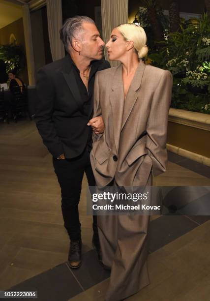 Christian Carino and Lady Gaga attend ELLE's 25th Annual Women In Hollywood Celebration presented by L'Oreal Paris, Hearts On Fire and CALVIN KLEIN...