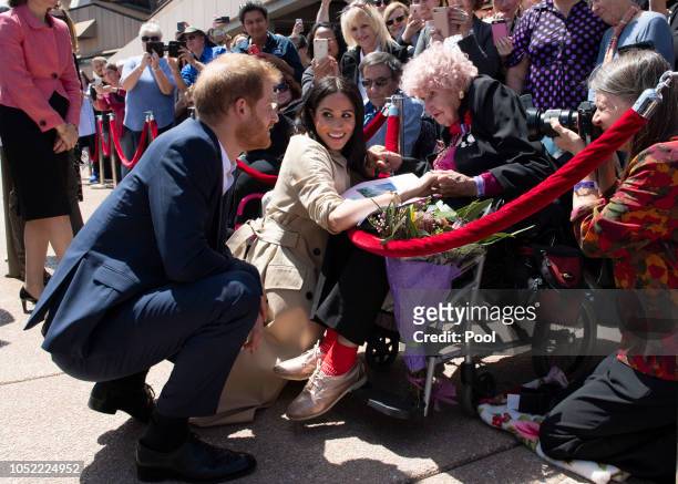 Prince Harry, Duke of Sussex and Meghan, Duchess of Sussex meet 98 year old Daphne Dunne during a meet and greet at the Sydney Opera House on October...