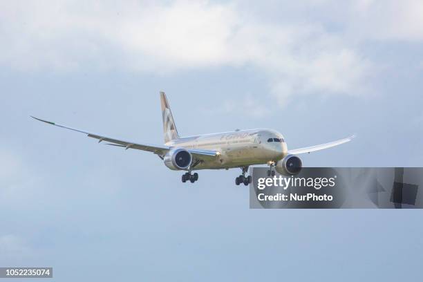 Etihad Airways Boeing 787-9 Dreamliner landing at Amsterdam Schiphol International Airport in Runway 27 during a rainy day. Etihad Airways connects...