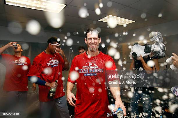 Pitcher Cliff Lee of the Texas Rangers celebrates his team's victory over the Tampa Bay Rays in Game 5 of the ALDS at Tropicana Field on October 12,...