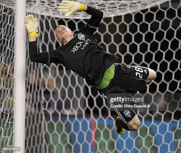 Goalkeeper Terry Boss of the Seattle Sounders FC leaps to block a shot against Chivas de Guadalajara on October 12, 2010 at Qwest Field in Seattle,...