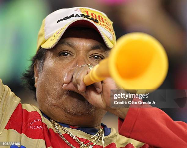 Fan of Chivas de Guadalajara blows a vuvuzela during the game against the Seattle Sounders FC on October 12, 2010 at Qwest Field in Seattle,...