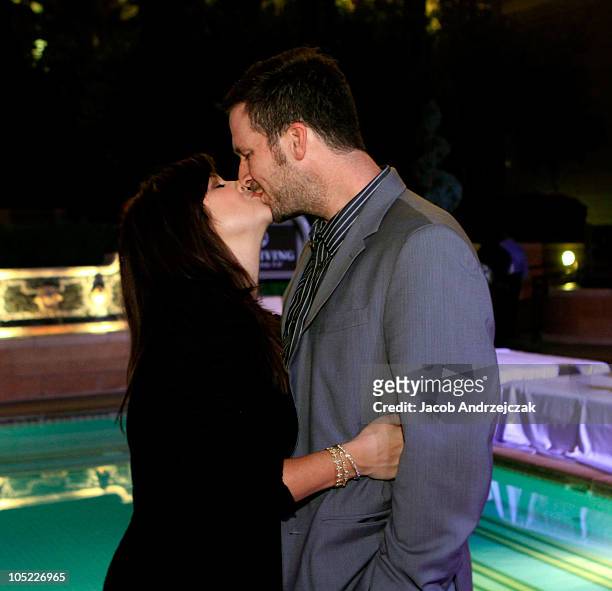 Actress Tiffani Thiessen and husband Brandy kiss at the launch of PetitNest at at The Palazzo on October 10, 2010 in Las Vegas, Nevada.