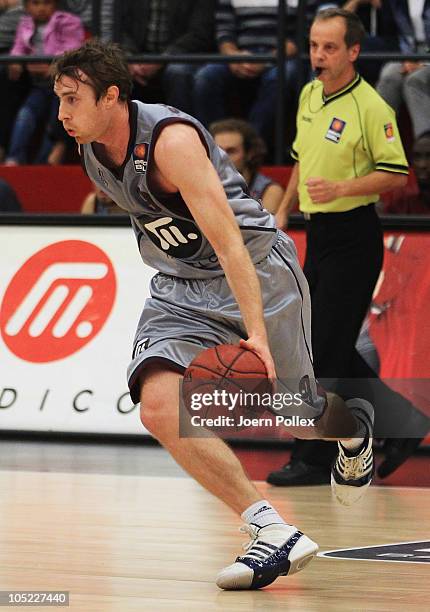 Johannes Strasser of Quakenbrueck controls the ball during the Basketball Bundesliga match between Artland Dragons and EWE Baskets Oldenburg at the...