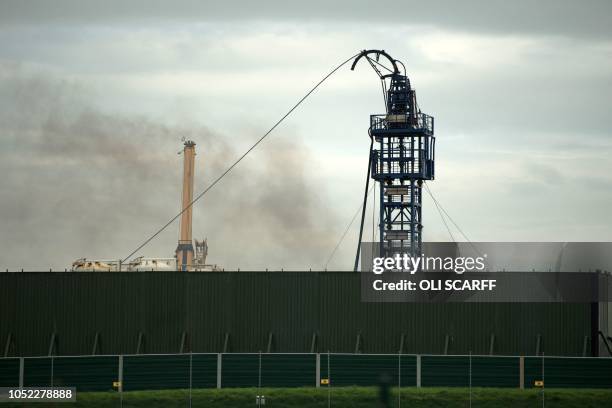 Smoke rises from the Preston New Road drill site where energy firm Cuadrilla Resources have commenced fracking operations to extract shale gas, near...