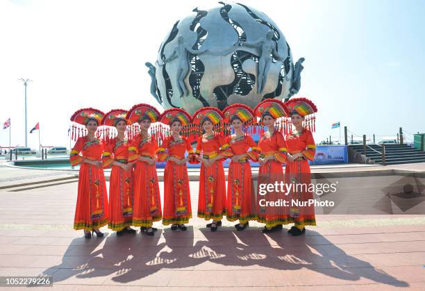 Group of podium hostesses wear Zhuang nation national dress during an opening ceremony ahead of the opening stage, Beihai 4km, of the 2nd Cycling...