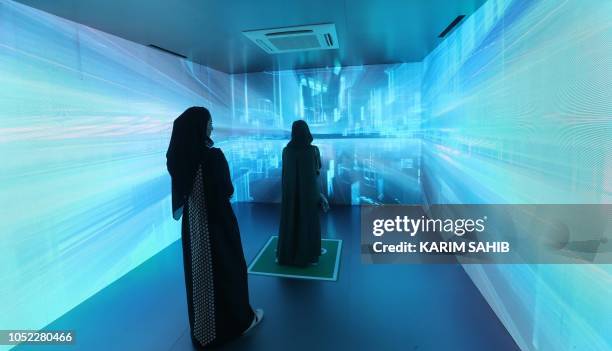 Saudi women attend the Gitex 2018 exhibition at the Dubai World Trade Center in Dubai on October 16, 2018. - Gitex is a consumer computer and...